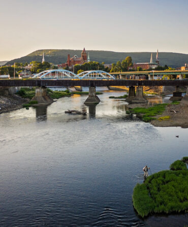 A downtown with a river and bridge