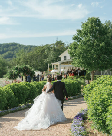 Newlyweds walk down a pathway