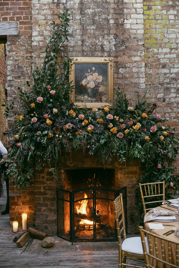 A fireplace outfitted with florals