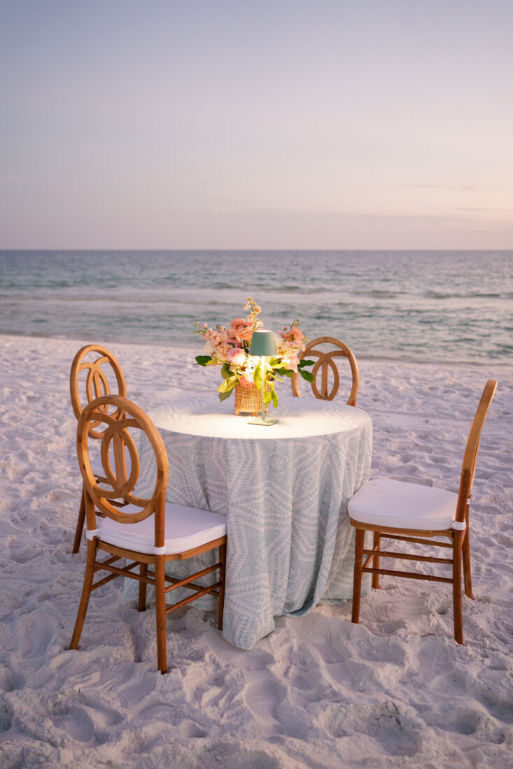 A wedding table setup on a beach