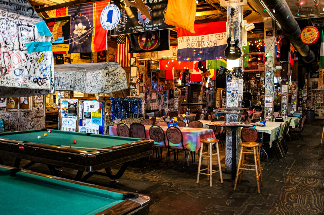 Inside a juke joint with pool tables