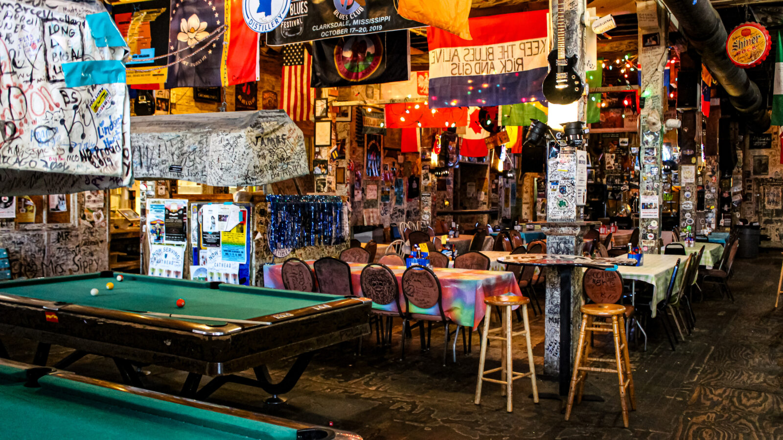 Inside a juke joint with pool tables