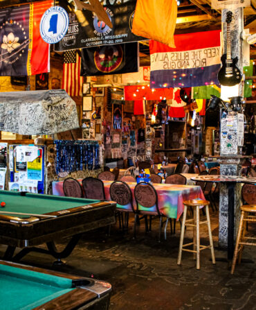 Inside a juke joint with pool tables