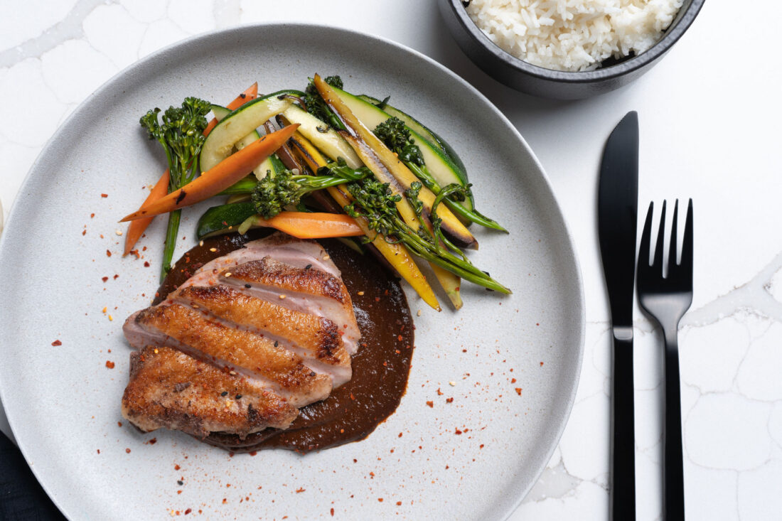 Duck breast on hibiscus and pecan mole.