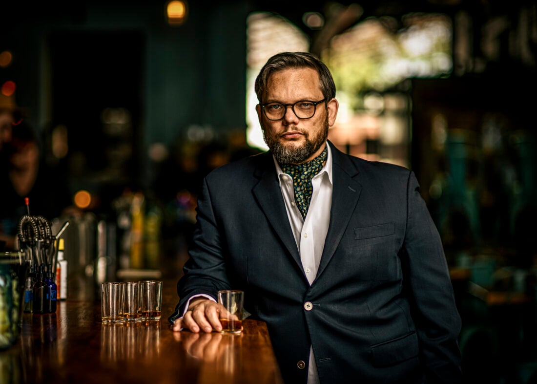 A portrait of a man with bourbon