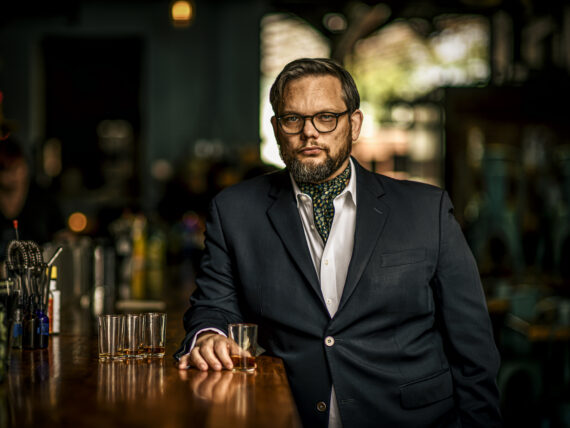 A portrait of a man with bourbon