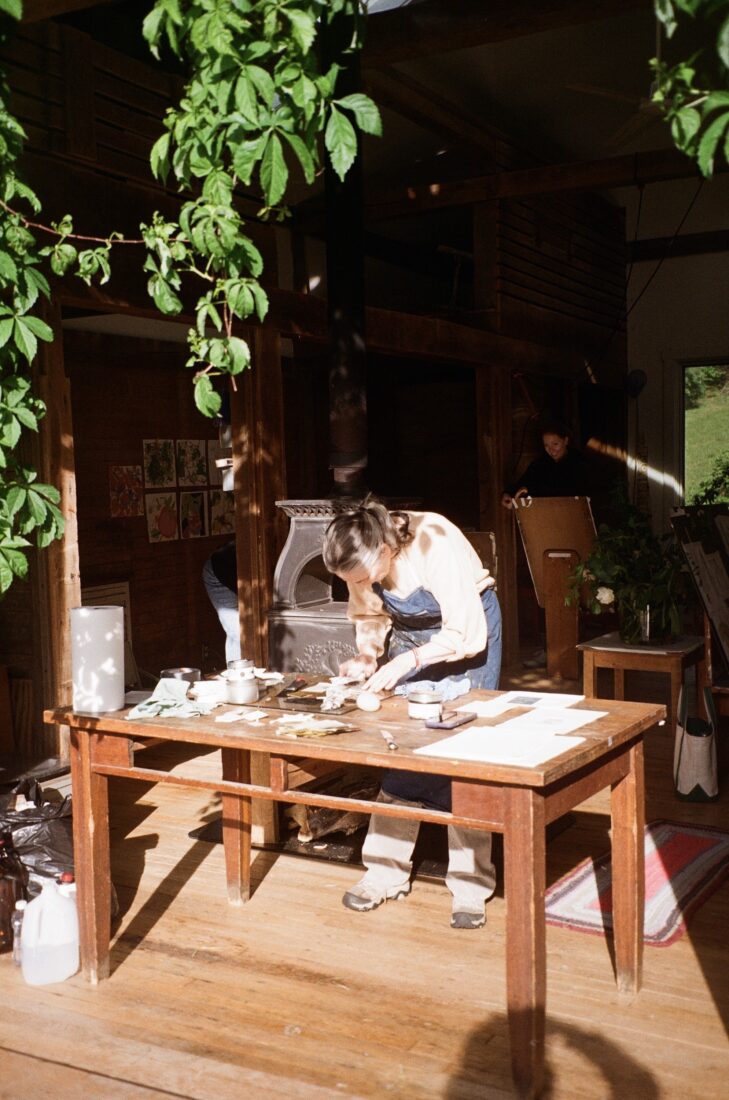 An artist in a studio in a barn
