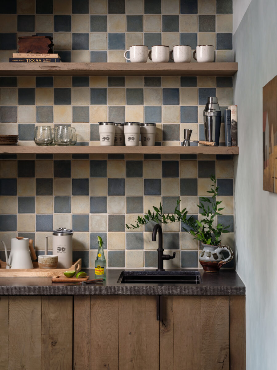 close up image of bar with blue and white backsplash