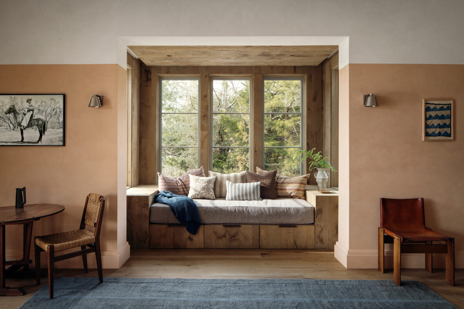 photo of a window seat against a white and tan wall