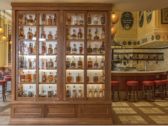 image of a wall of shelves with bourbon