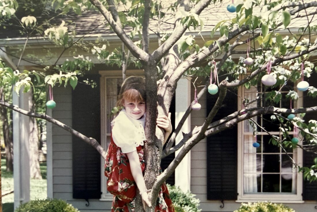 A girl in an easter egg tree