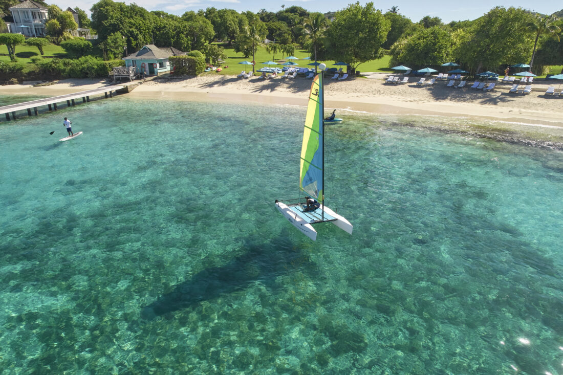 A person on a catamaran on a beach