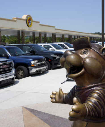 A beaver statue in a parking lot