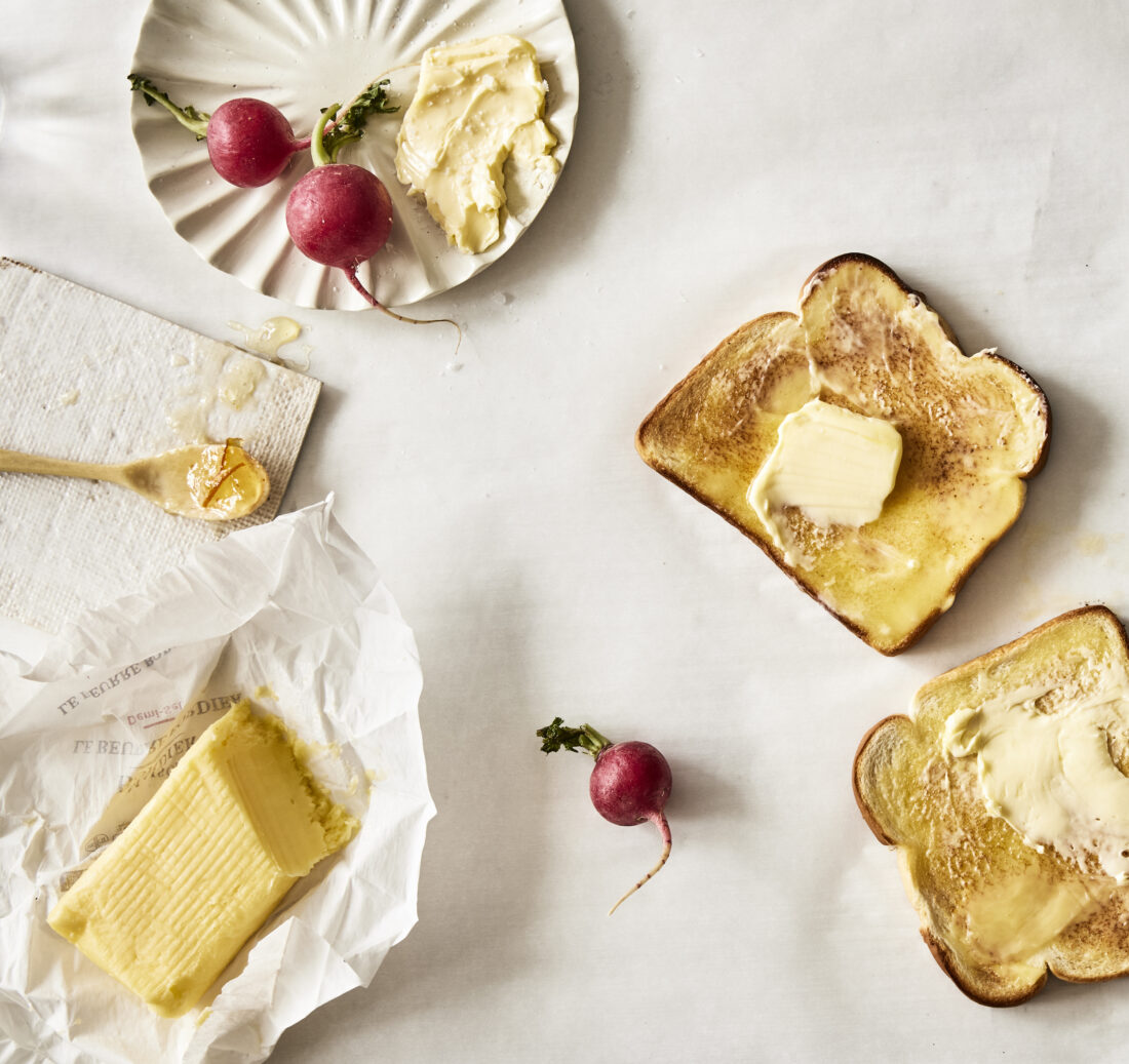 A plate of radishes with butter and toast