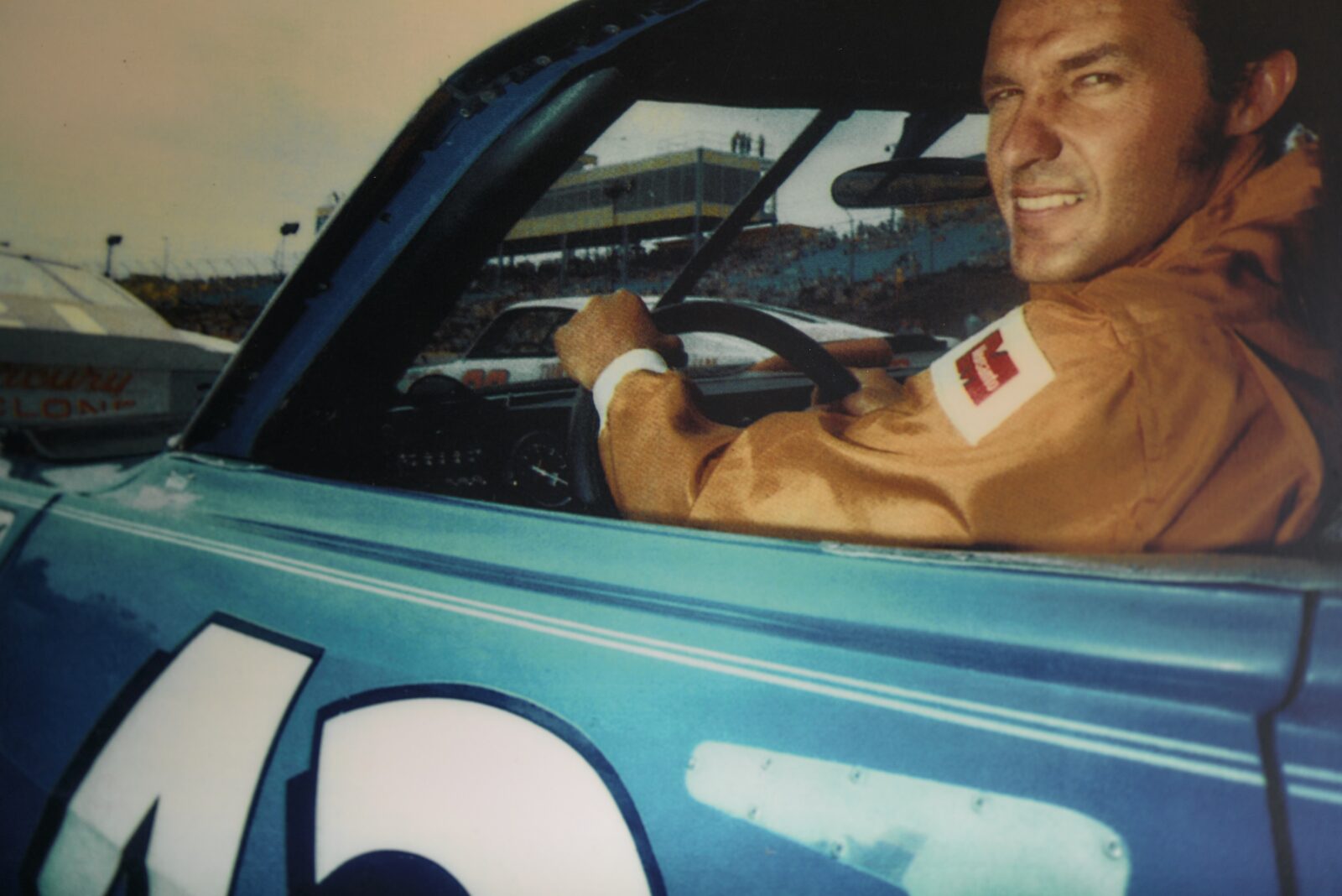 A race car driver in the driver's seat