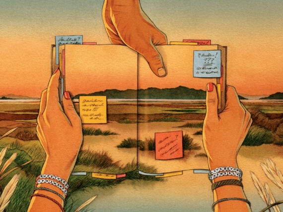 An illustration of two hands holding a book with a photo of a marsh