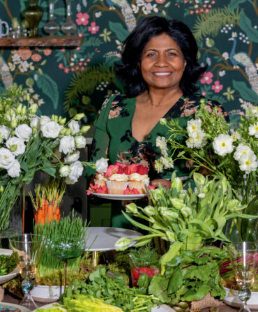 A woman surrounded by flowers
