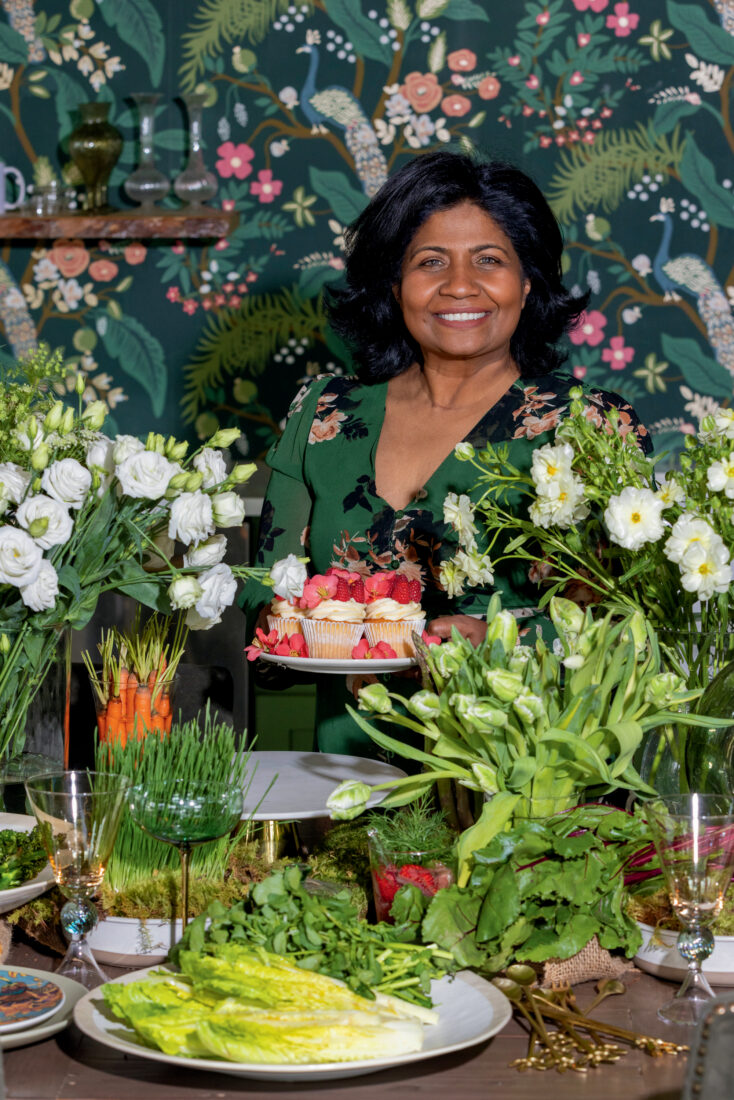 A woman surrounded by flowers