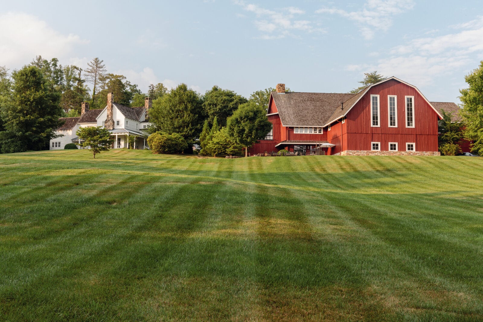 A red farm on a green field