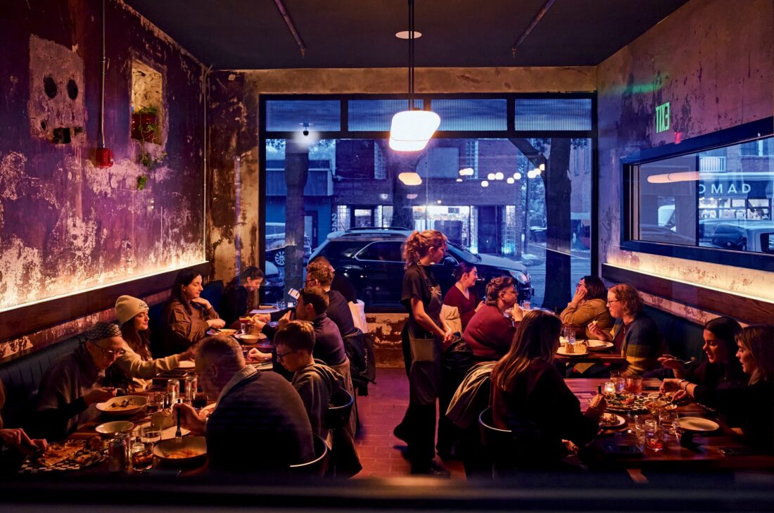 Image of the interior of Lucia Pasta Bar at night.