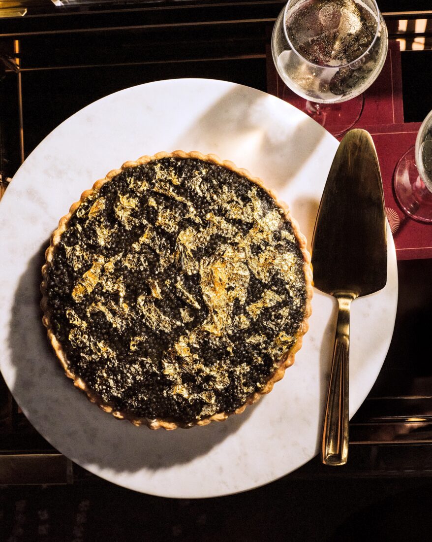 Golf leaf decorates the top of a caviar pie.