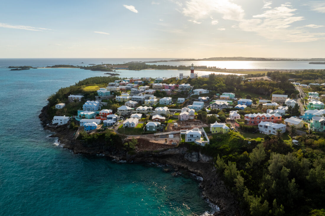 An aerial view of a small town surrounded by water