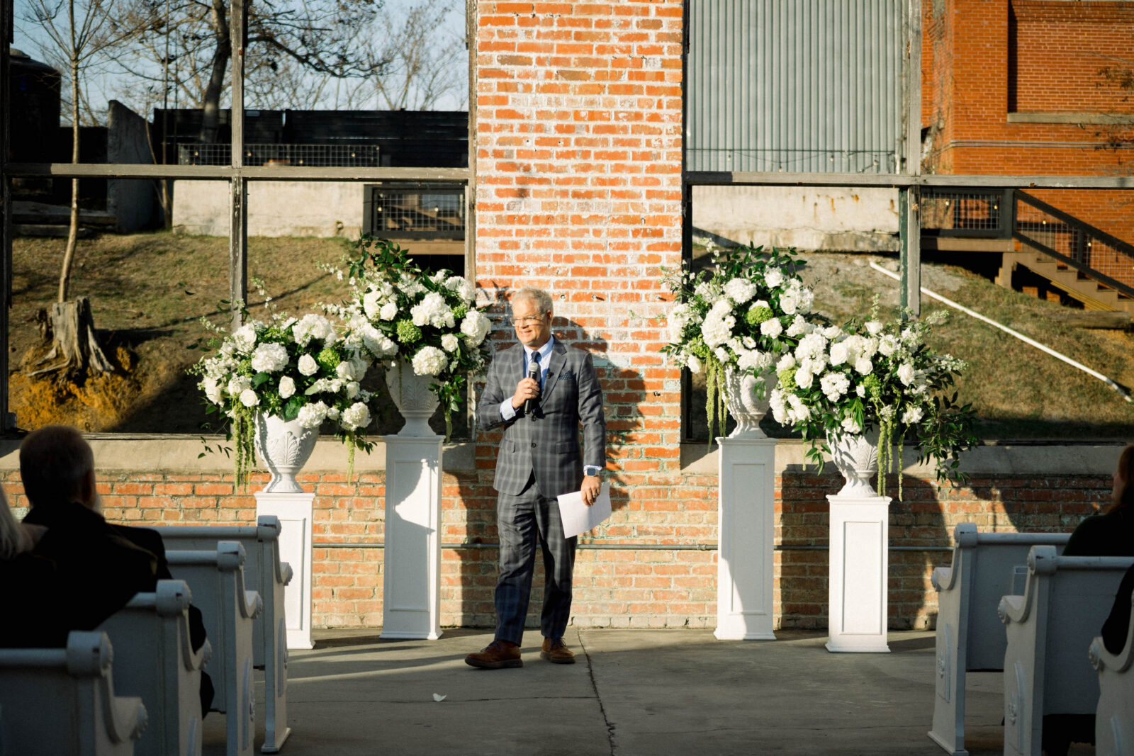 A man at an altar with flowers