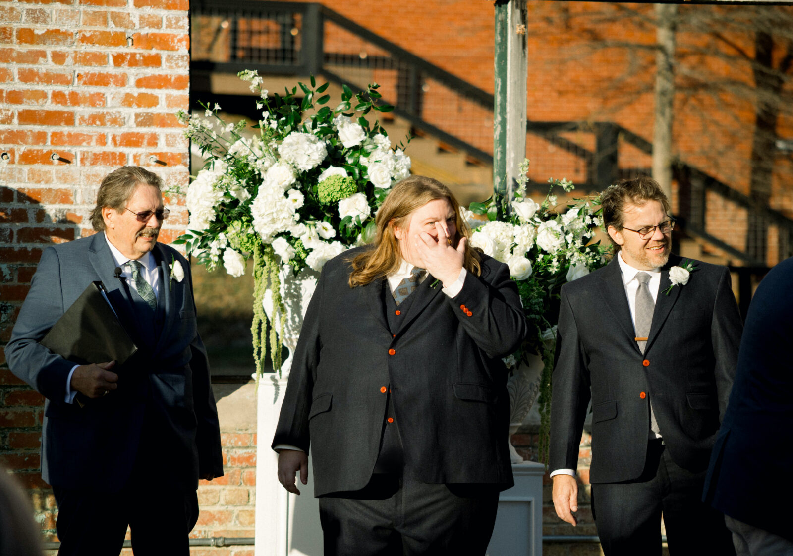 A wedding party at an altar