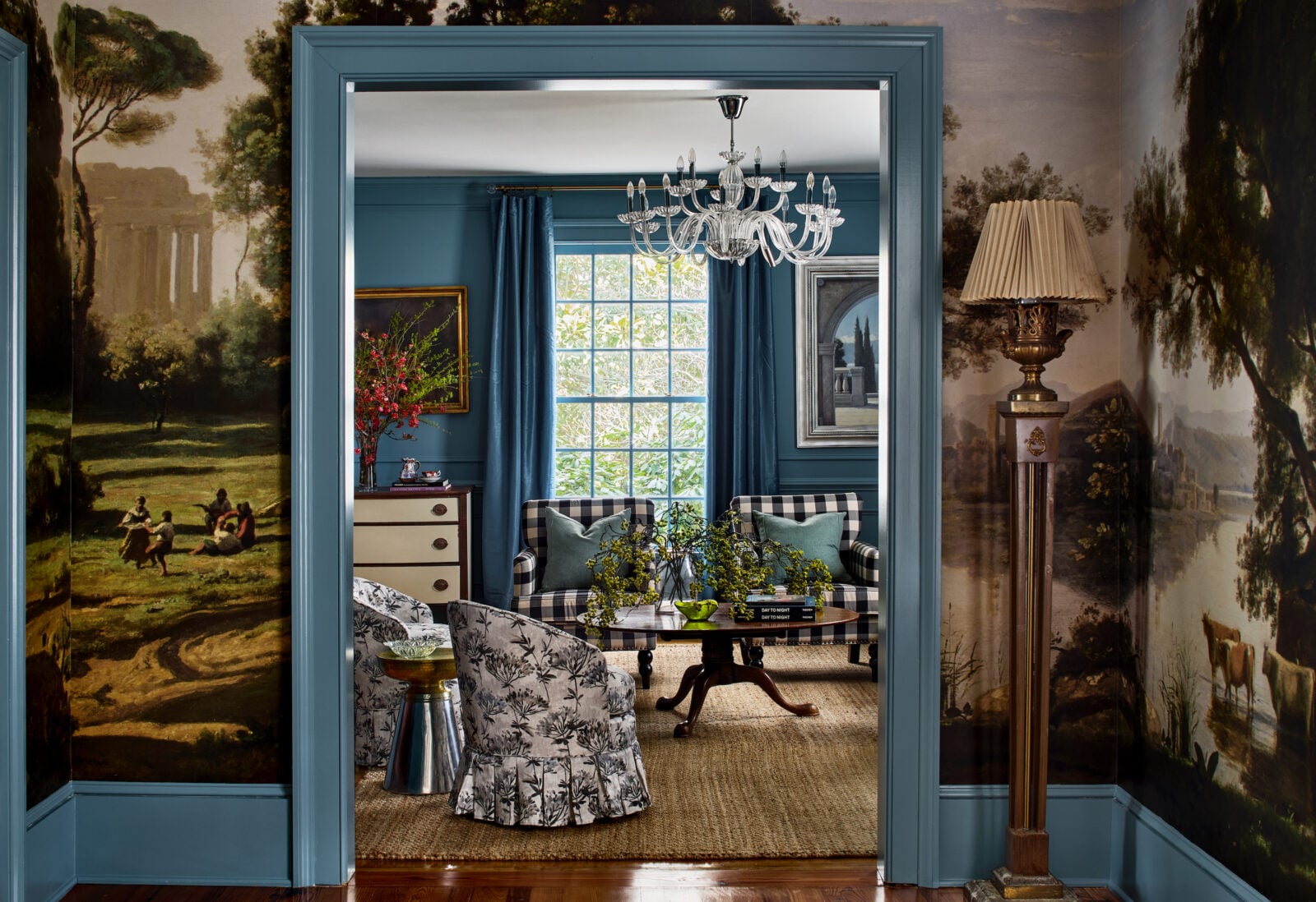 A navy living room with a mural