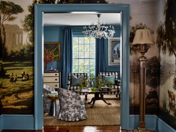 A navy living room with a mural