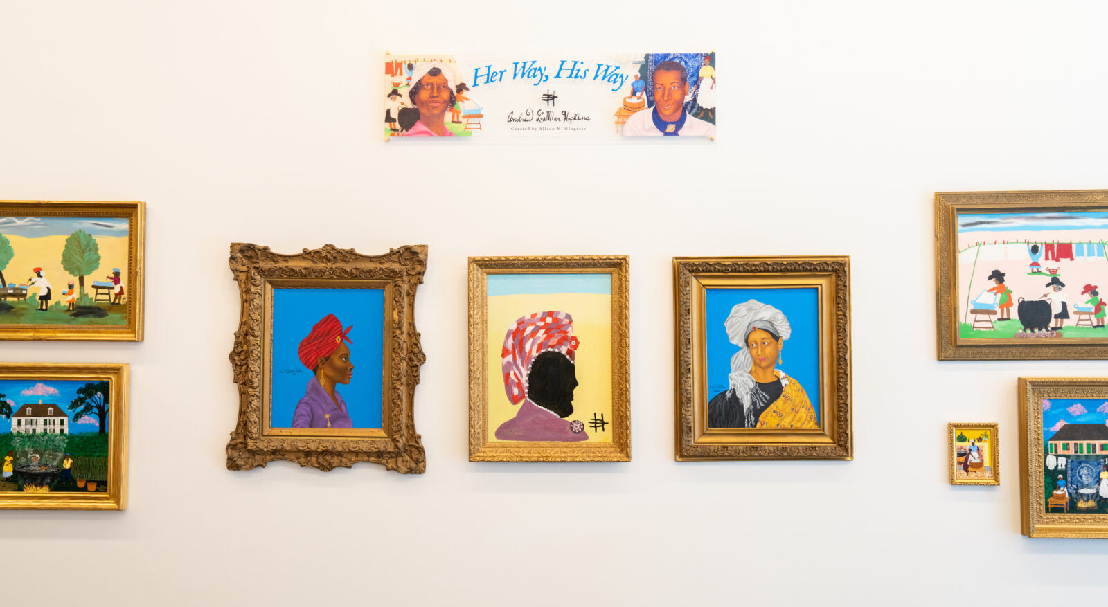 Artwork on walls with portraits and garden scenes