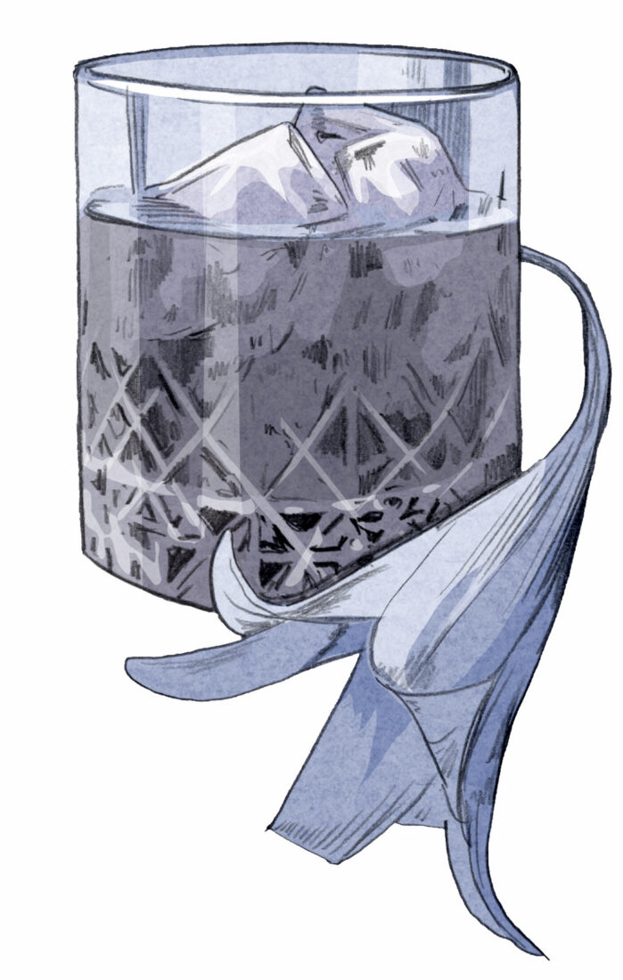 A lily by a bourbon glass