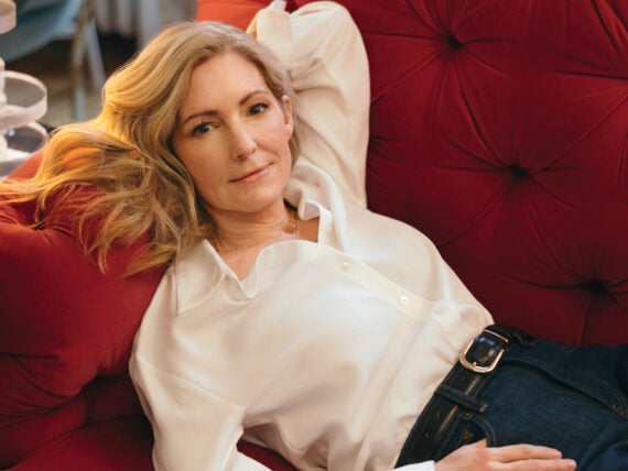 A woman on a red sofa