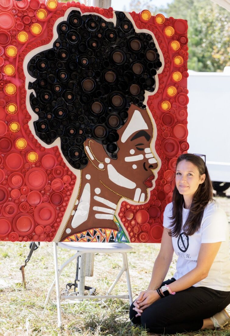 image of Heather Elson posed with one of her pieces.