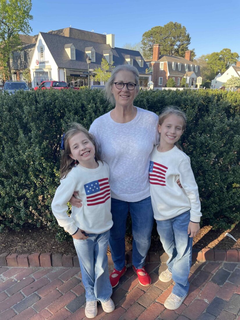 A family photo of a grandmother and two girls