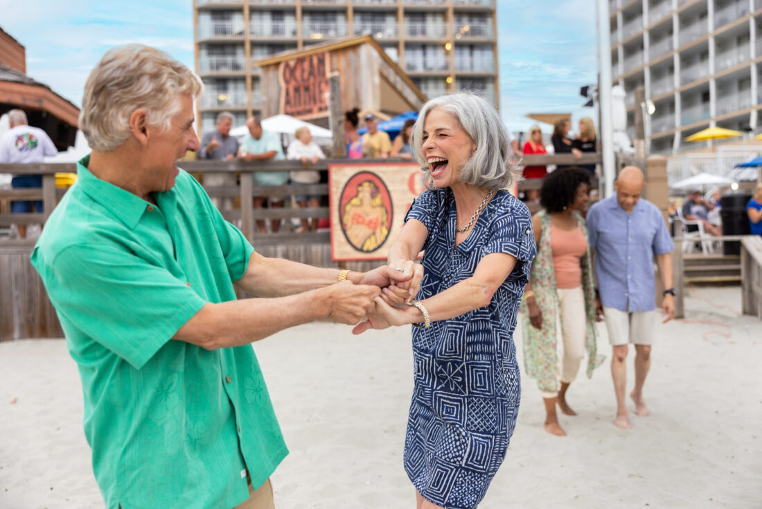 People dance on the beach