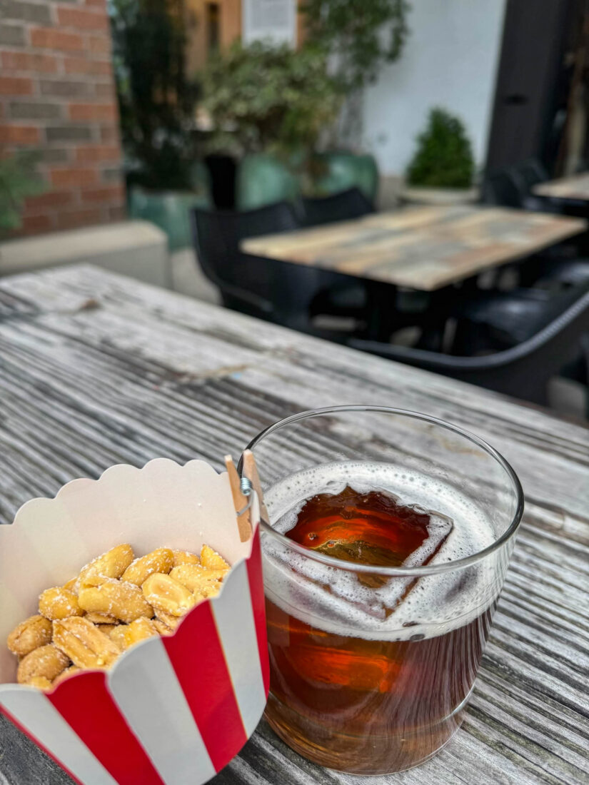 Peanuts and a coke cocktail on a table
