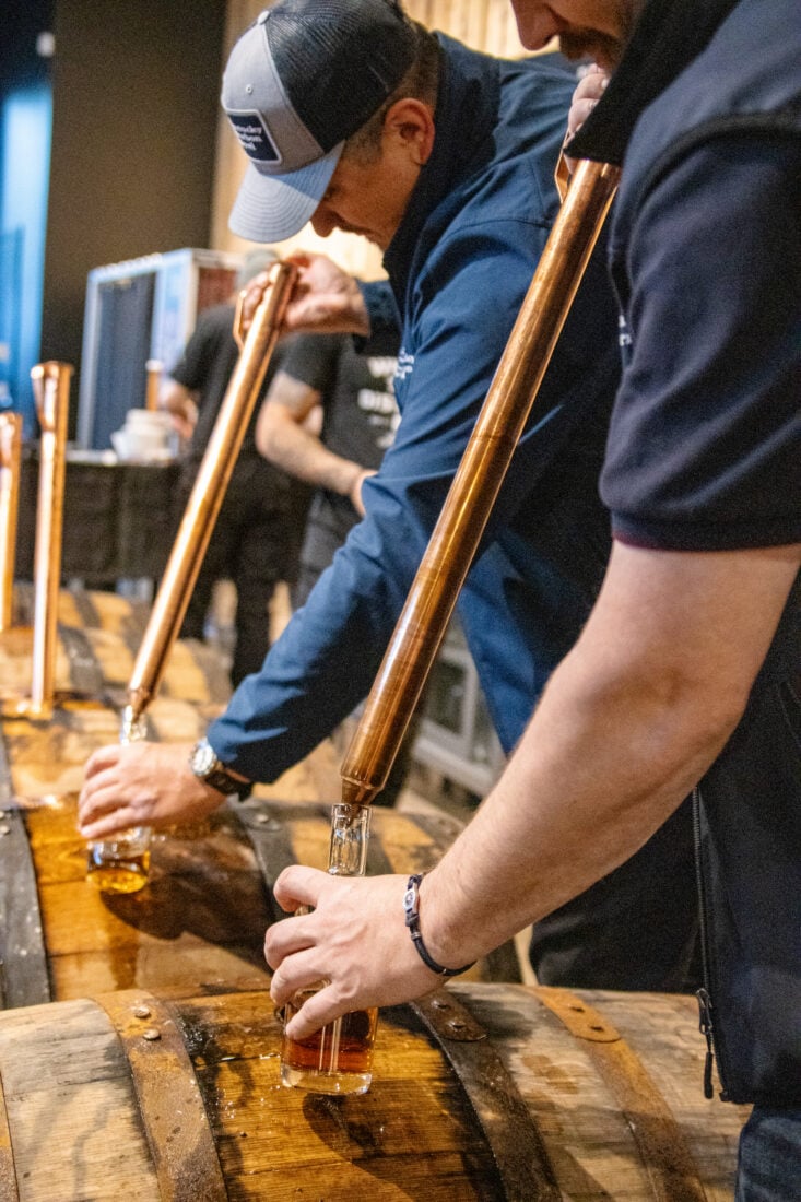 Sampling bourbon barrels