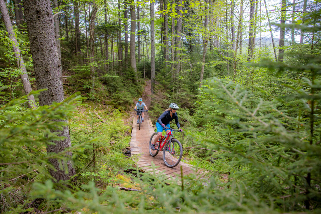 People bike on a trail