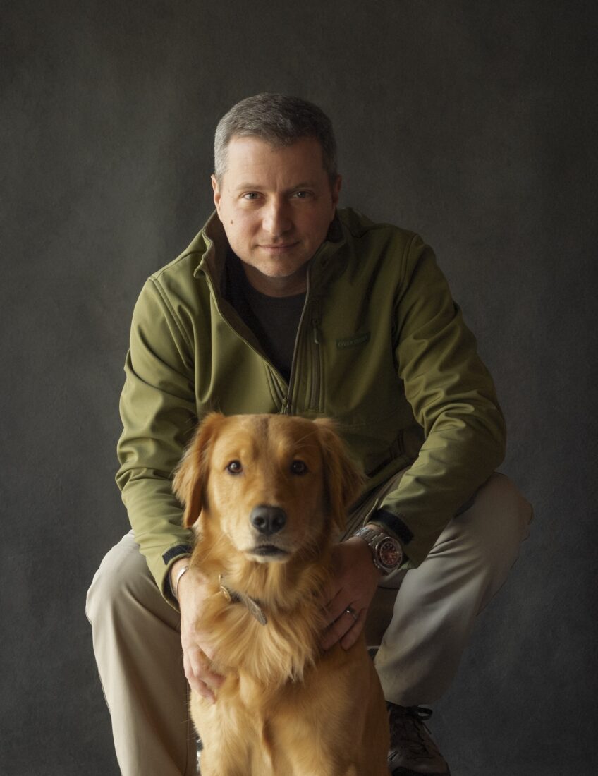 A man and a golden retriever