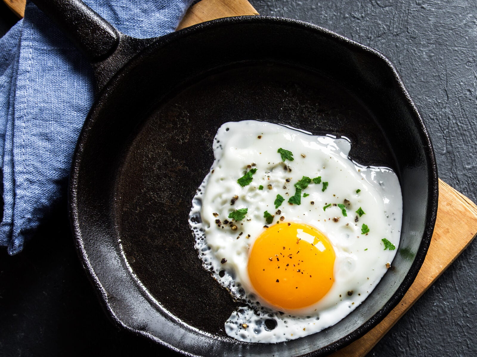 A fried egg in a cast iron skillet