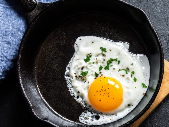 A fried egg in a cast iron skillet