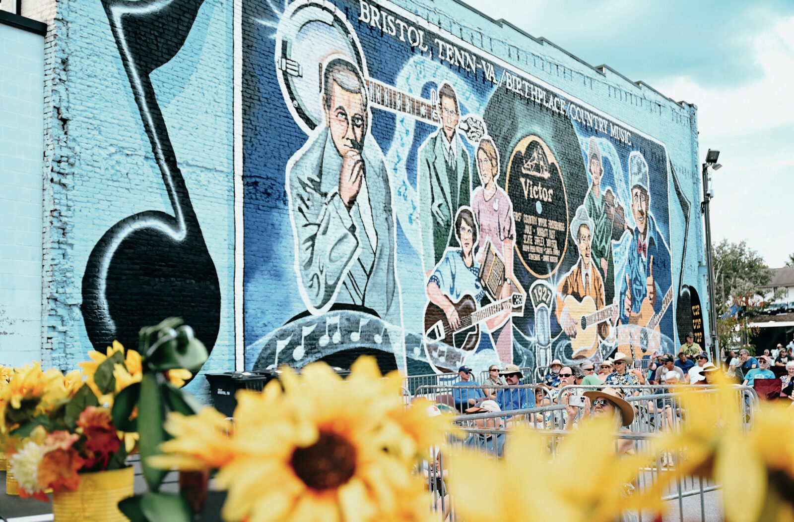 A painted mural; of country singers