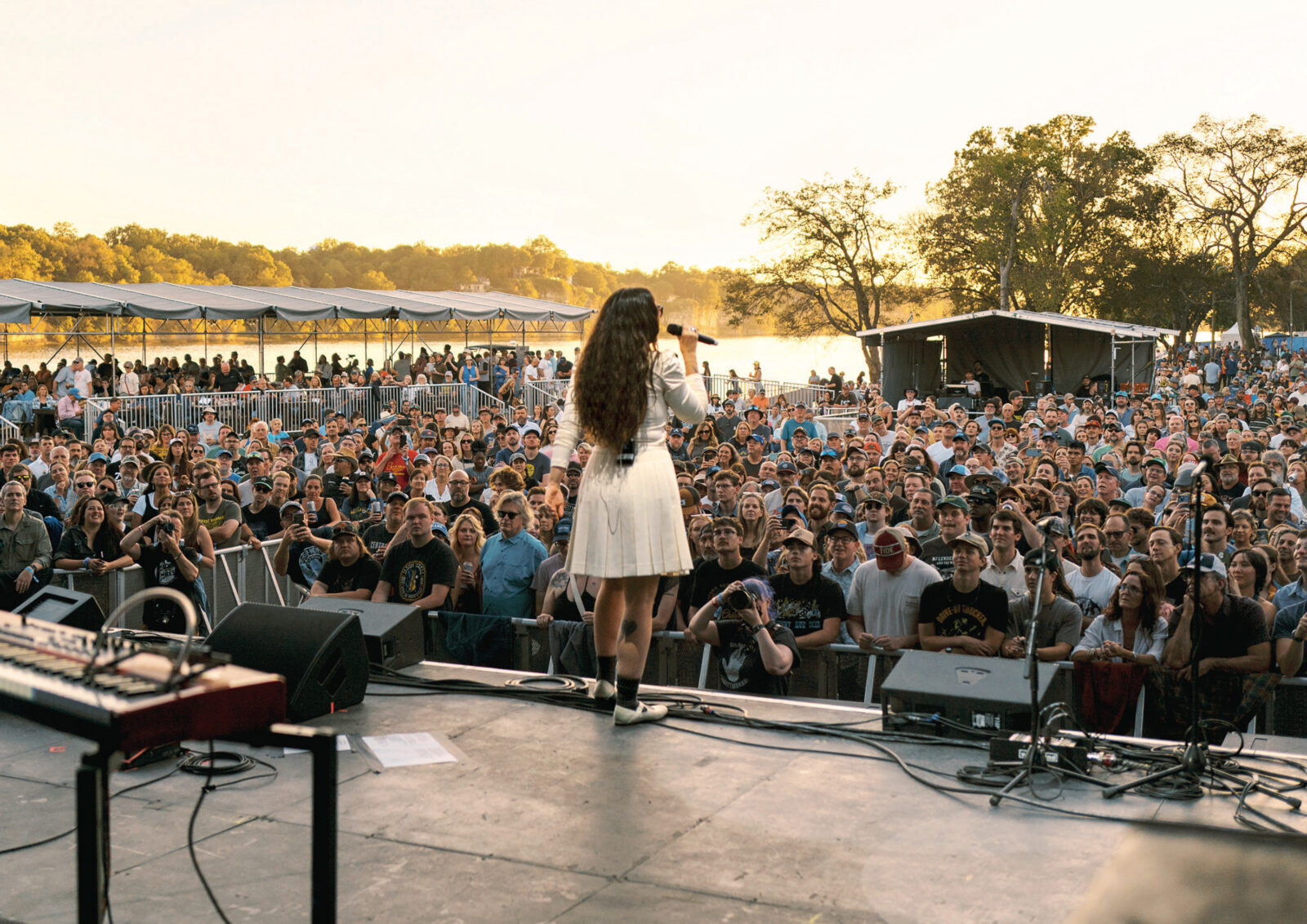 A woman performs on a stage