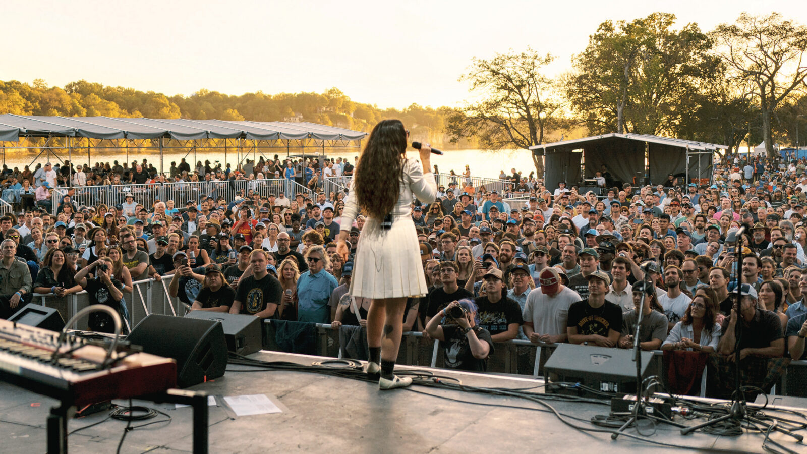 A woman performs on a stage