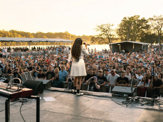 A woman performs on a stage