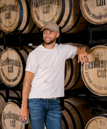Steph Curry with bourbon barrels