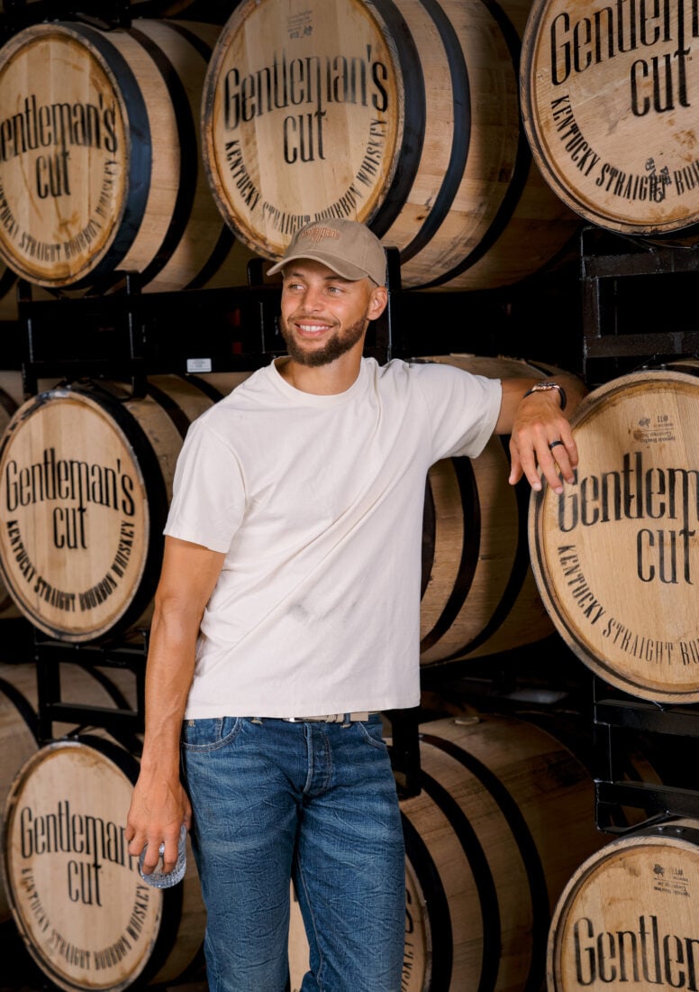 Steph Curry with bourbon barrels