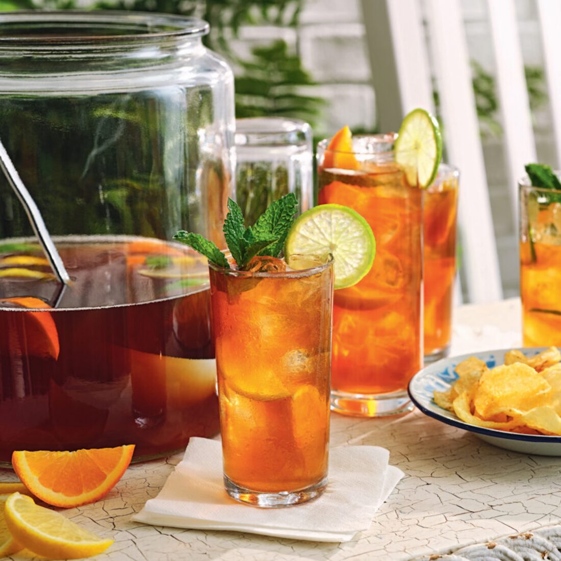 pitchers and glasses of punch on an outdoor table