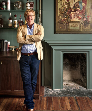 A portrait of a man in an office